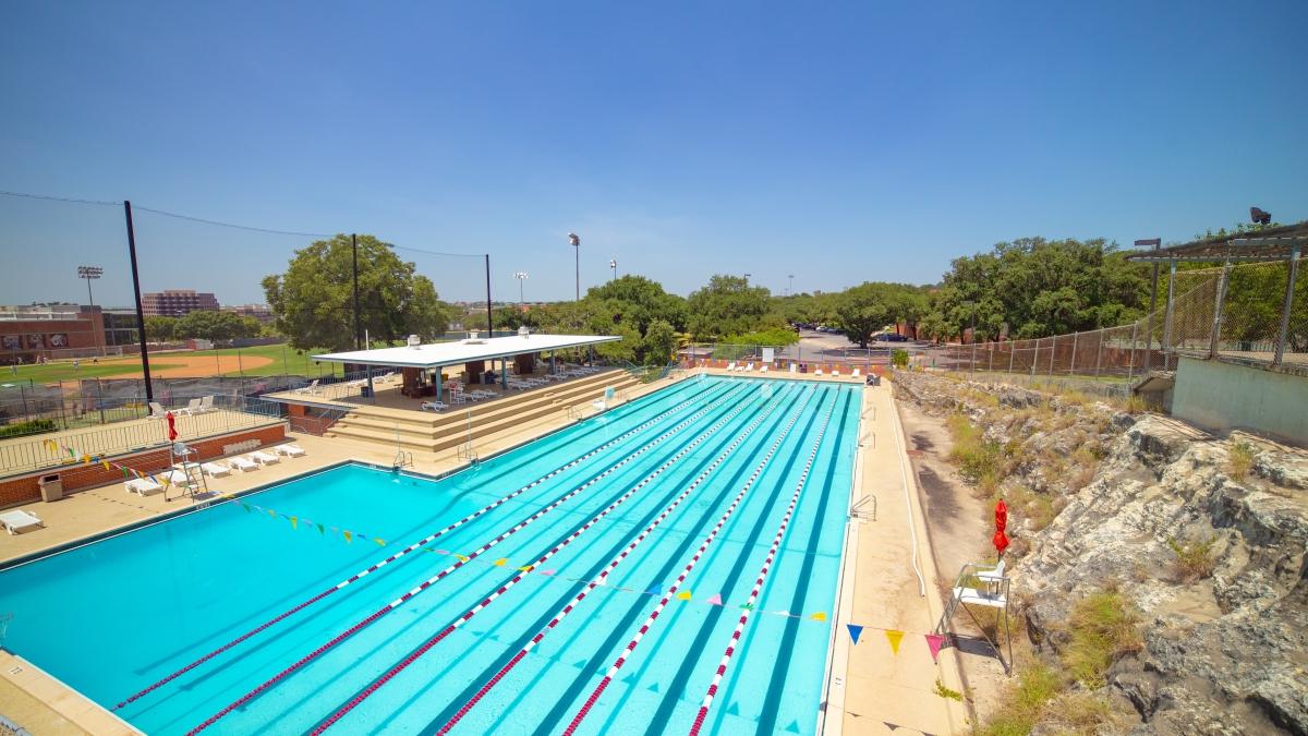 Aerial view of Trinity's outdoor pool on a clear blue day. 