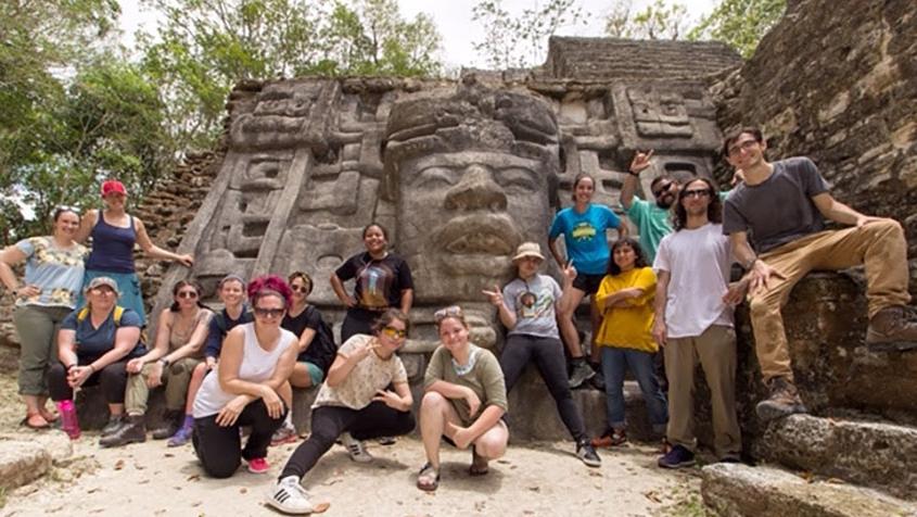 Group of students pose in front of Maya site in Belize 